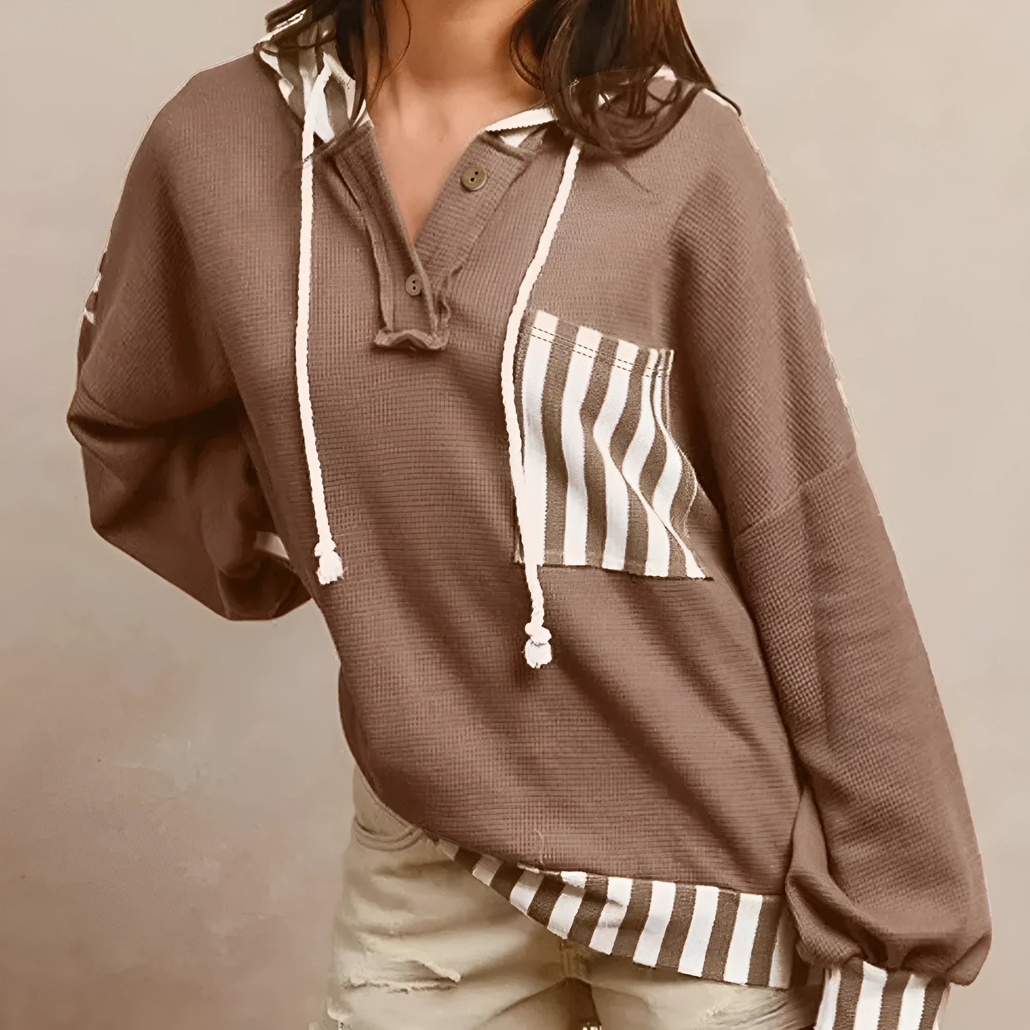 Straw yellow women's hoodie with waffle texture, patchwork stripes, button neck, and drawstring hood.