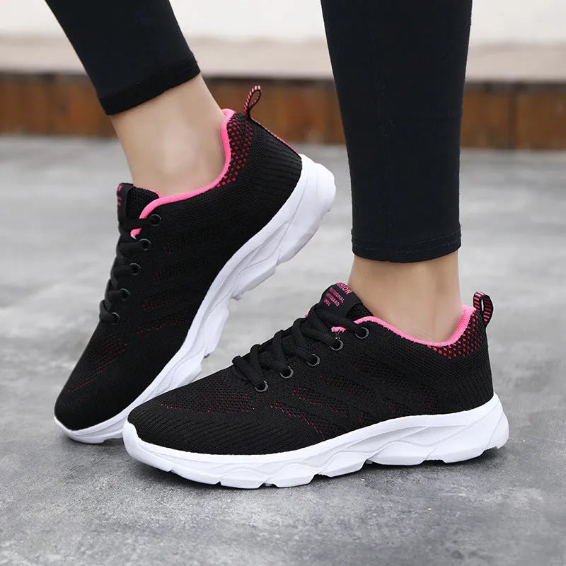 Women's breathable mesh running shoes with Flyknit upper, round toe, flat heel, in black pink colour