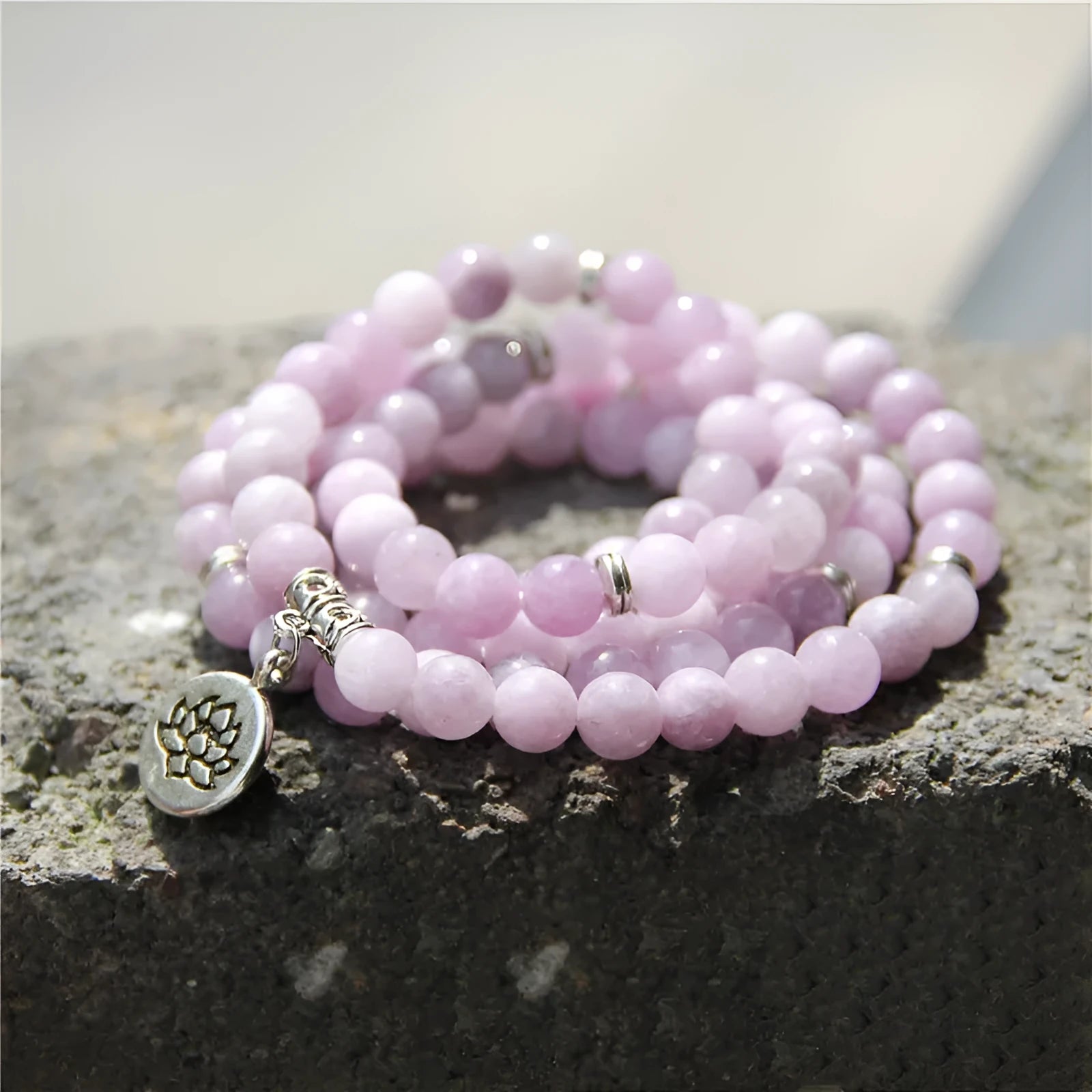 Natural stone angel echeveria bracelet in geometric shape with lotus detail on a white background.