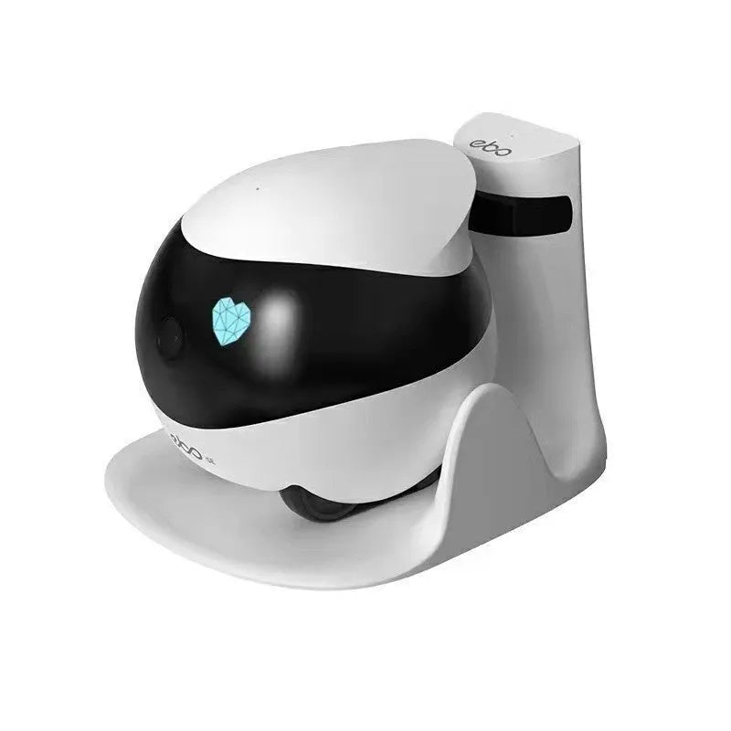 White smart home mobile robot camera with camera lens on a compact, wheeled body.
