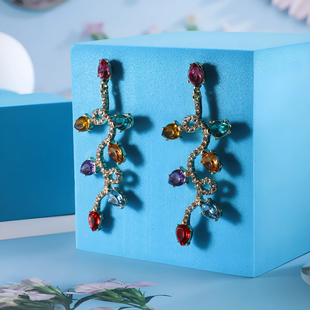 Retro fashion small lantern zircon stud earrings in colourful alloy on white background