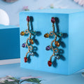Retro fashion small lantern zircon stud earrings in colourful alloy on white background