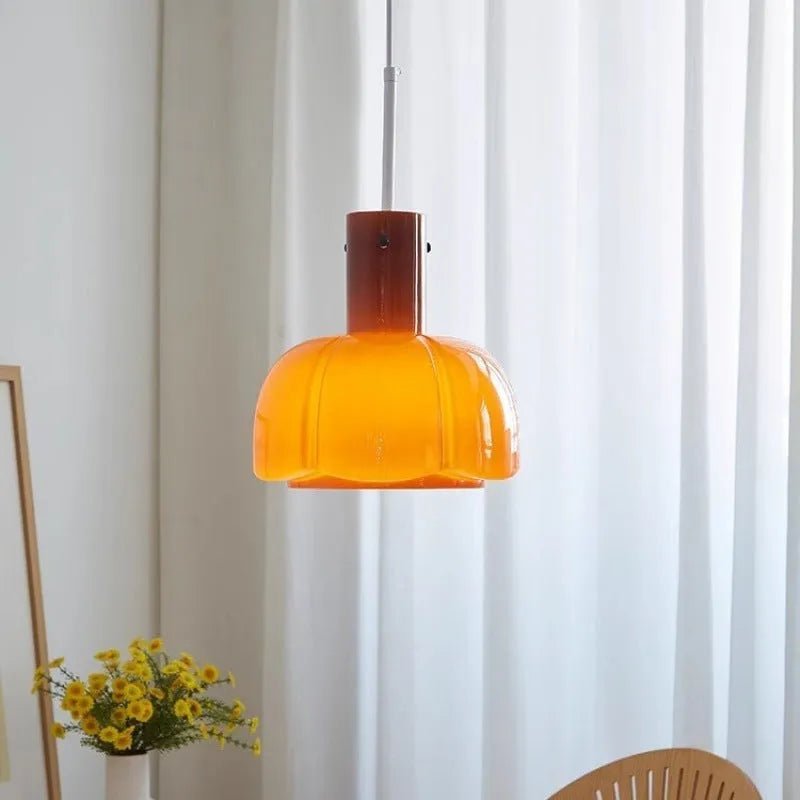 Close-up of a retro medieval-style glass bud chandelier pendant light with a warm glow.