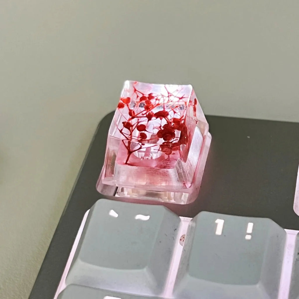 Transparent resin starry sky keycap with glitter particles in red, pink, green, violet colours for mechanical keyboards