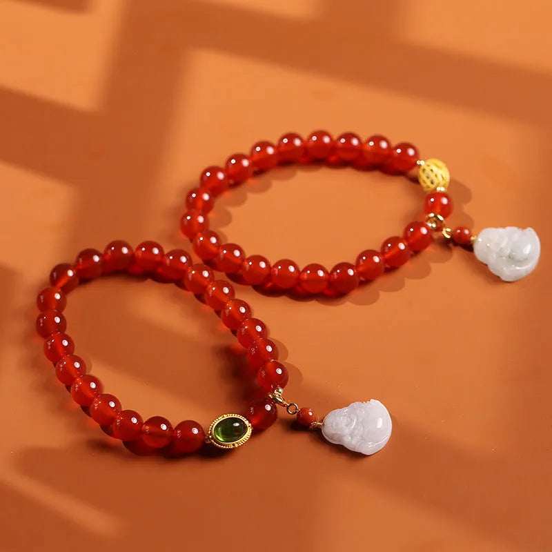 Red agate bracelet with ancient gold jade hanging element and Buddha pendant