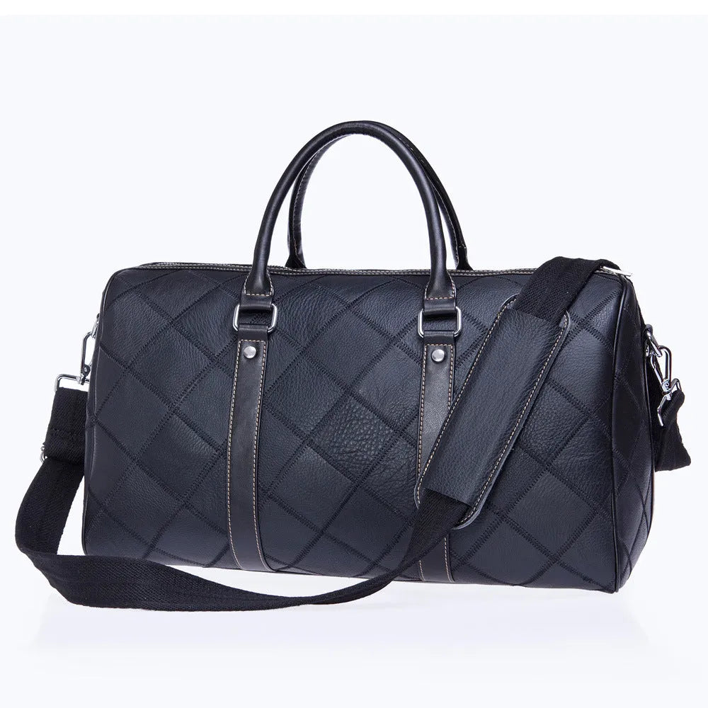 Vintage brown cowhide leather duffel bag with a single strap and internal organiser pockets.
