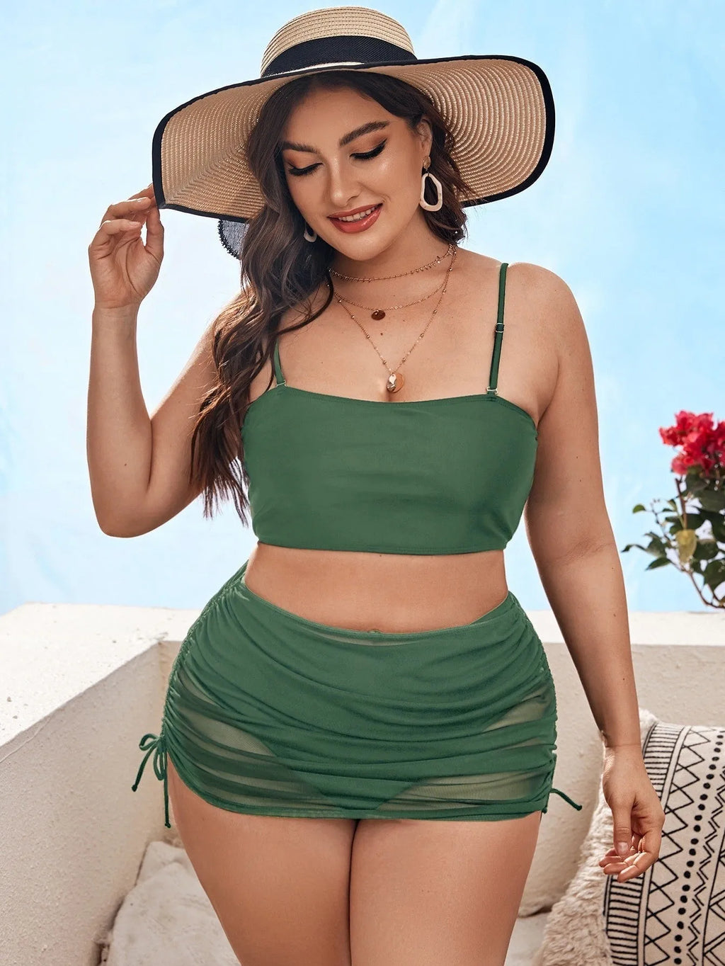 Women's solid colour mesh bikini three-piece set with top, underwear, and apron on mannequin