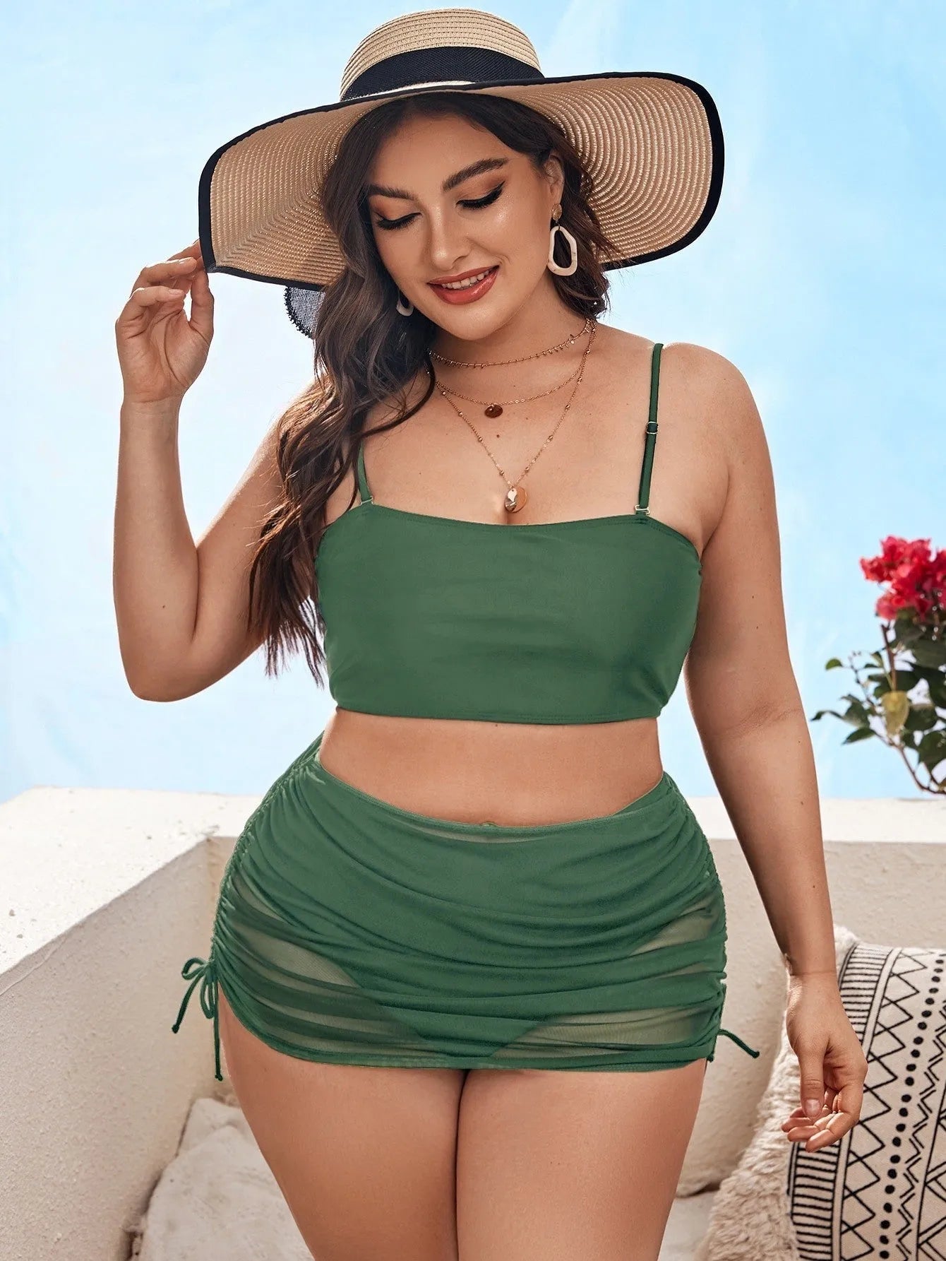 Women's solid colour mesh bikini three-piece set with top, underwear, and apron on mannequin