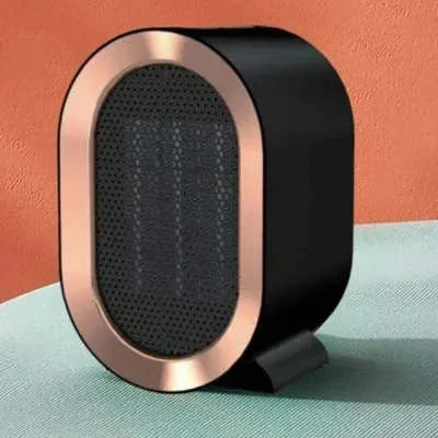 A compact black desktop ceramic fan heater with mechanical control dials.