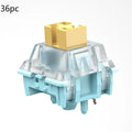 36 Sea Salt Lemon PRO Mute coloured mechanical keyboard switches arranged in packaging.