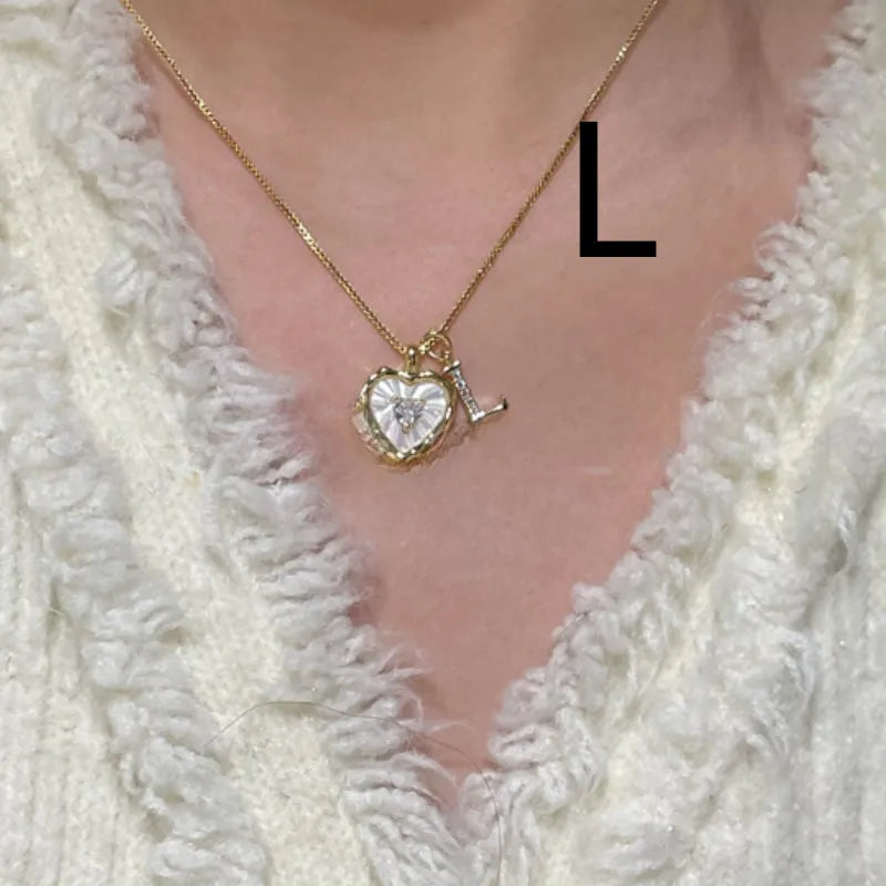 Women's pendant necklace with titanium steel chain and natural mother-of-pearl in heart-shaped design