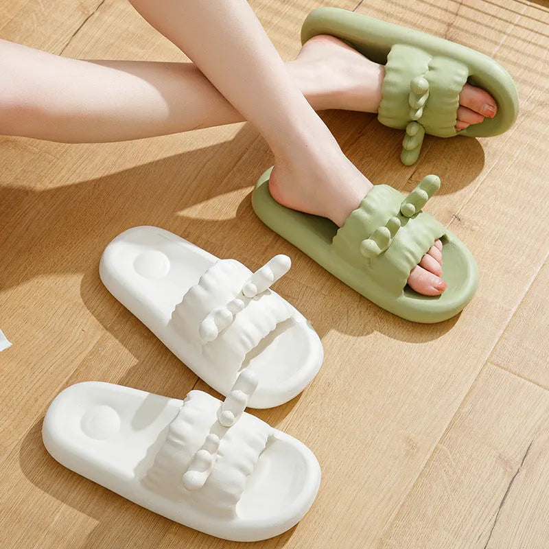 Women's deer horn design flip flop slippers in light yellow on a white background.