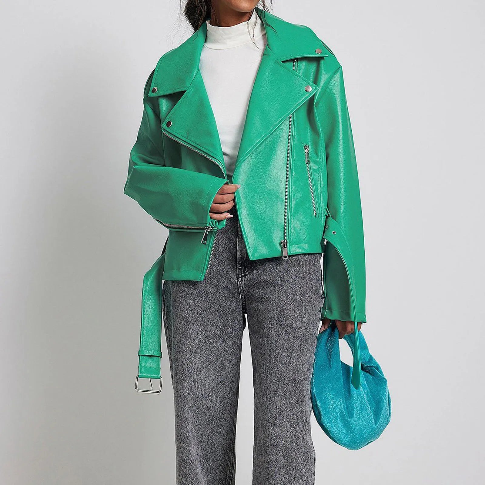 Black punk-style short jacket with a Peter Pan collar, lapel, and waist belt on a hanger.
