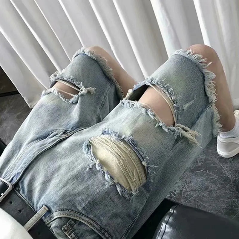 Men's thin ripped denim shorts in retro colour with handmade distressing, Bermuda length, size L