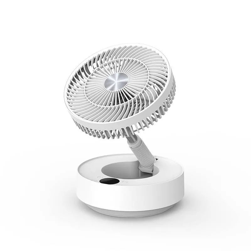 Green telescopic floor fan extended to full height with magnetic remote control attached