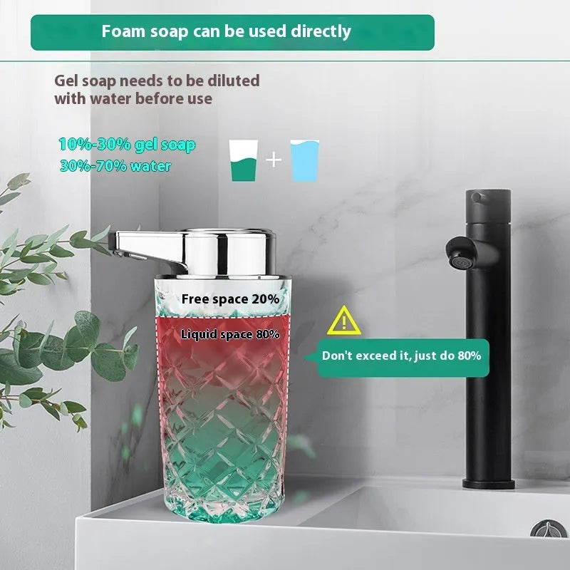 Silver automatic soap dispenser with USB Type-C charging port on a bathroom countertop.