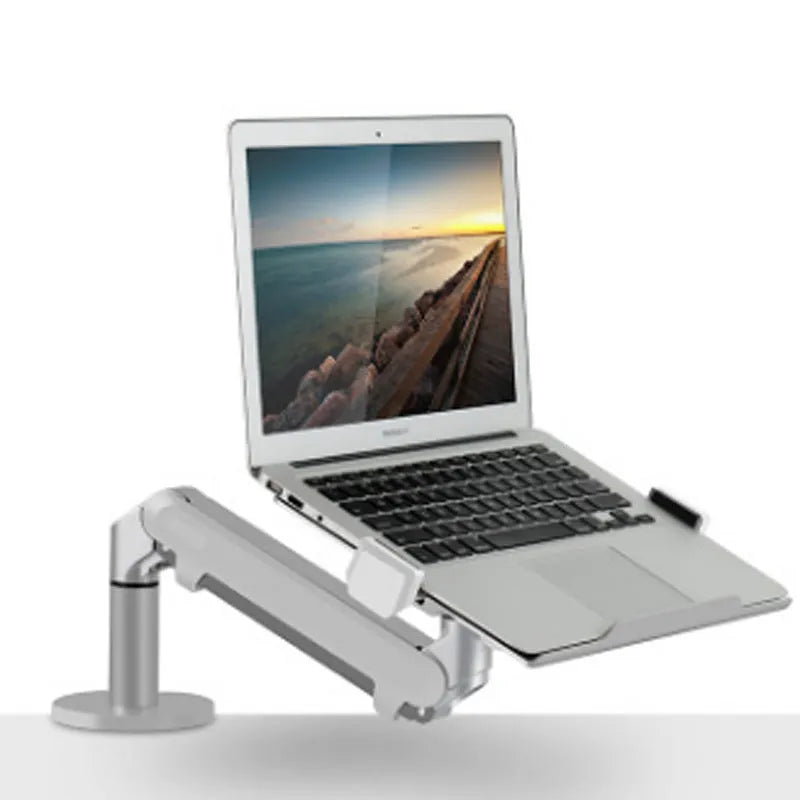 Silver aluminium laptop stand with adjustable air pressure arm bracket holding a MacBook notebook.
