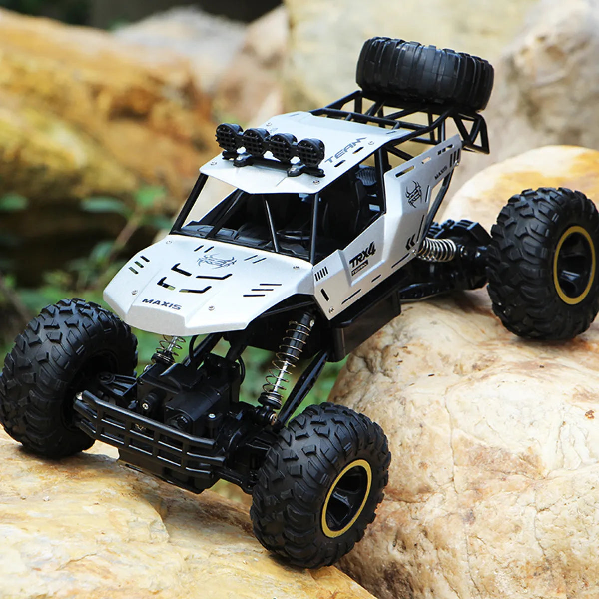 Large black 4WD off-road remote control car with 2.4G wireless controller on rough terrain