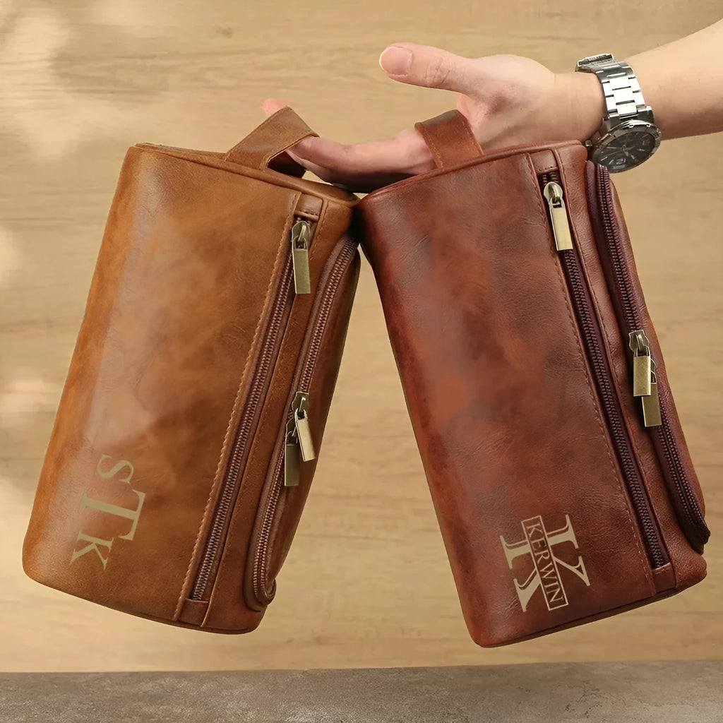 Men's black PU travel bag set with a matching makeup pouch for accessory storage.