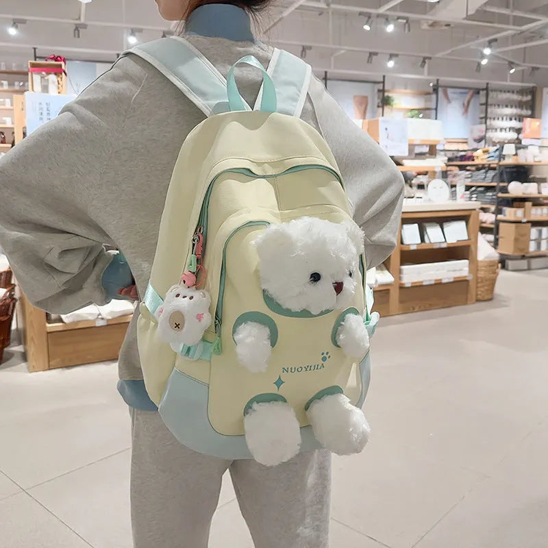 Nylon school backpack with curved shoulder straps in macaron colours including yellow pink