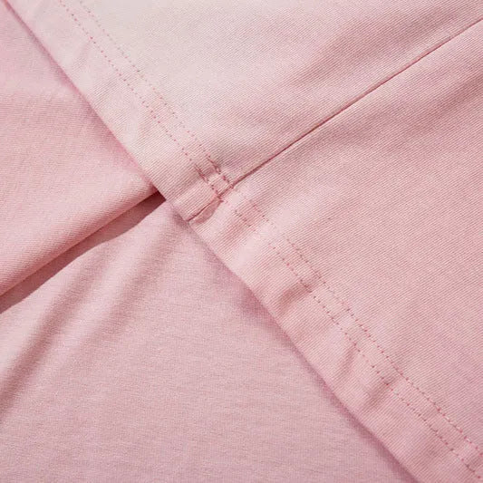 Women's loose cotton pullover top with drop shoulder sleeves in dark grey or pink colours