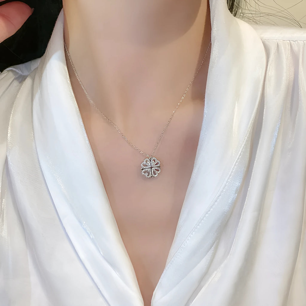 Heart shape four leaf clover pendant necklace in cupronickel 18K gold finish on white background