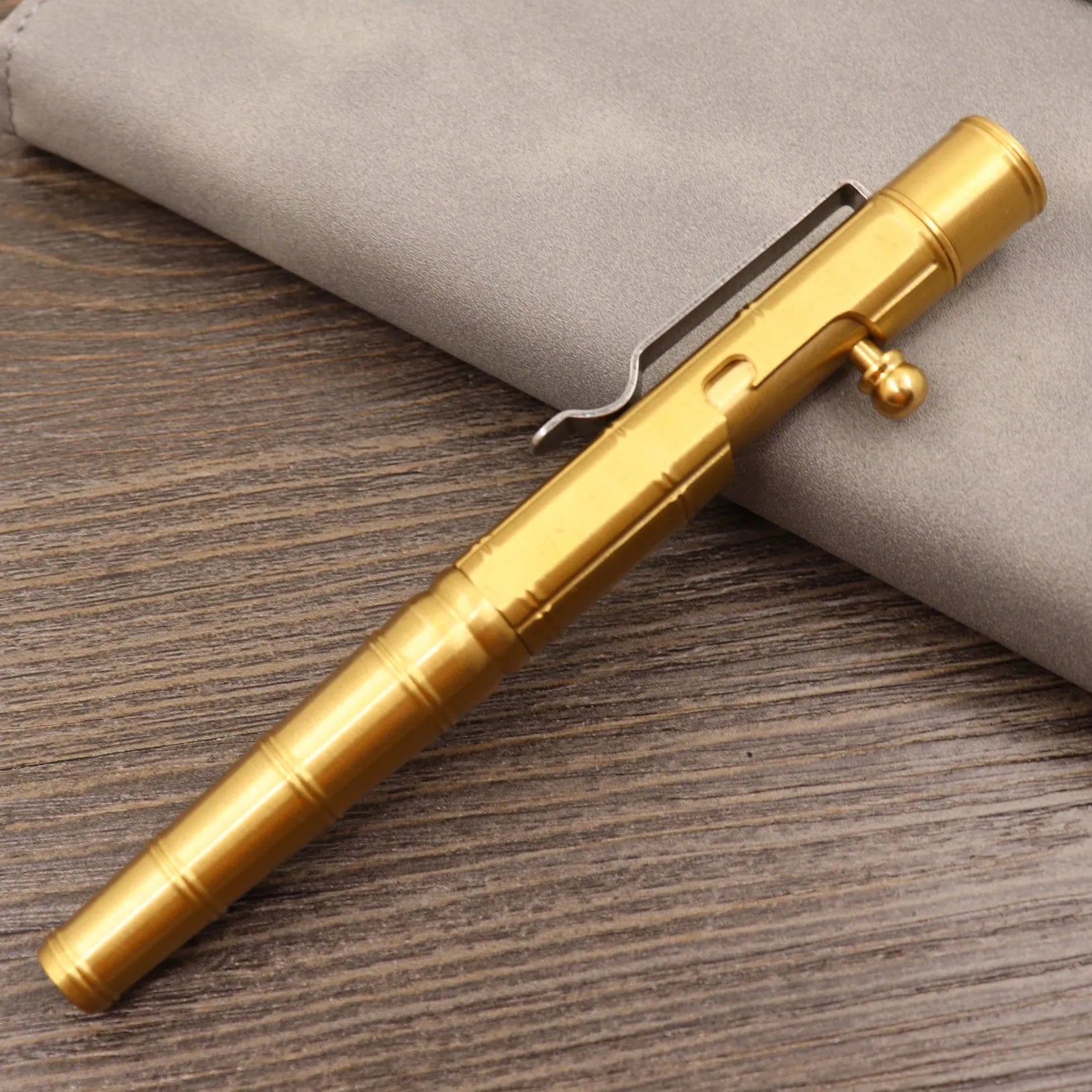 Brass tactical pen with retro colour finish and press mechanism