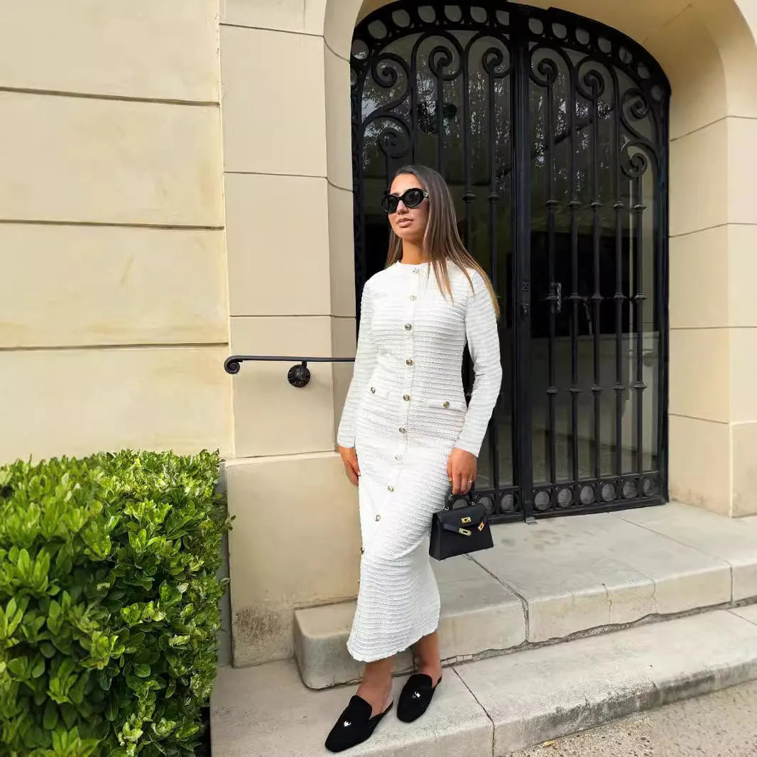 French retro slim fit long-sleeved knitted dress with button detail, shown in black and white colour options.