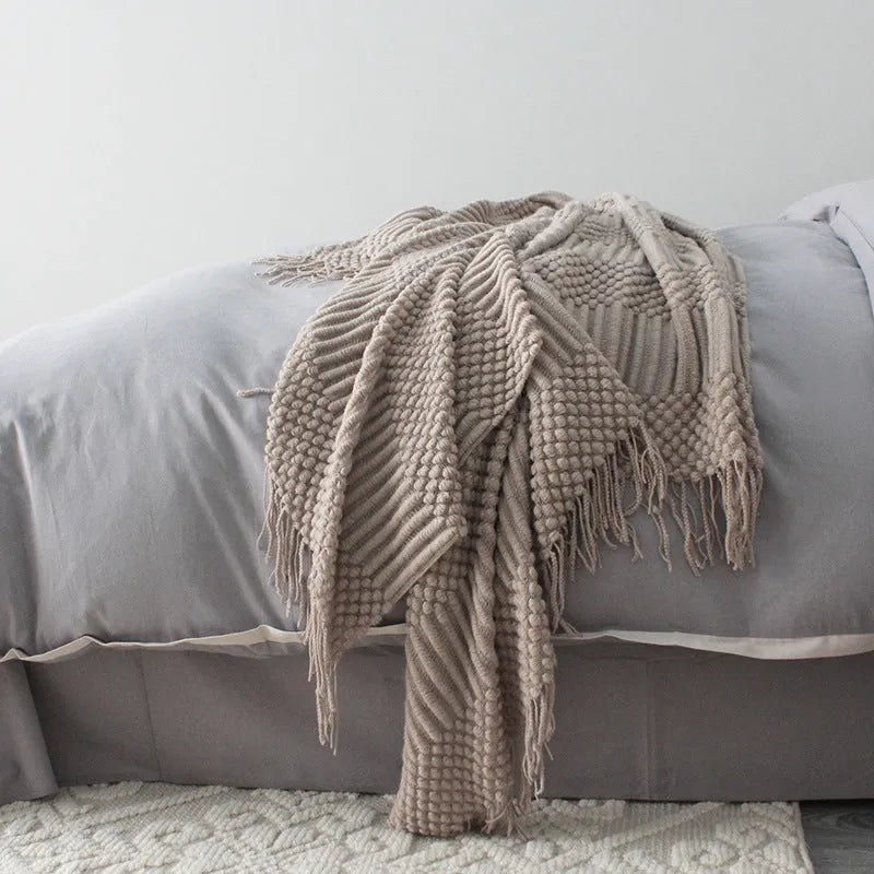 Small light grey polyester nap blanket laid flat showing its 127x170cm size.