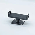 Universal alloy wall rack holding a tablet and a large mobile phone in vertical orientation