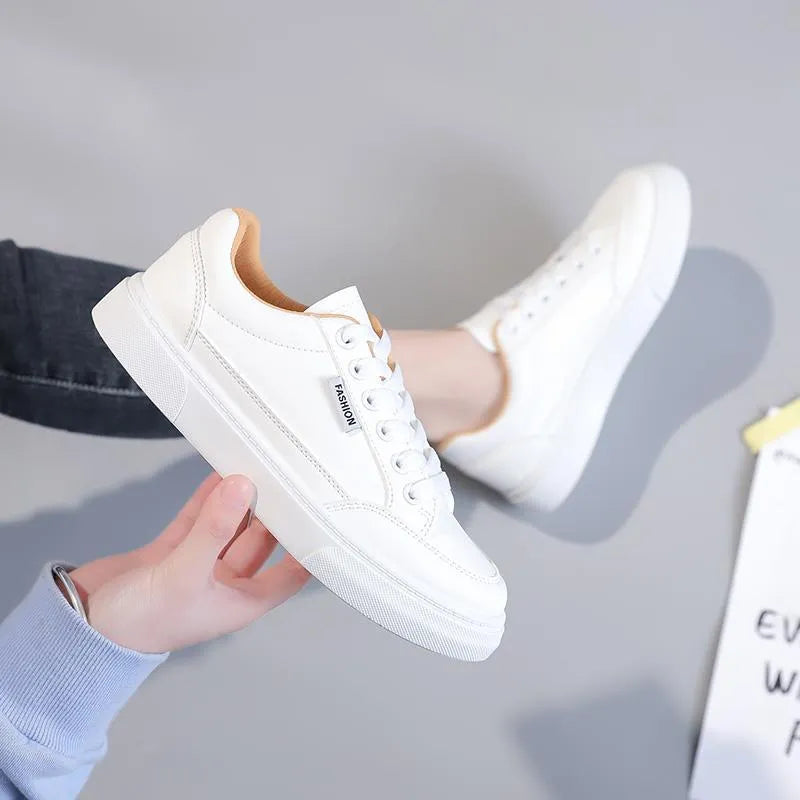 Women's low-top Korean style sneakers in white or brown artificial PU with a solid colour design.