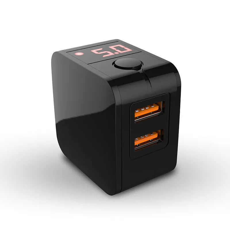 White dual USB travel wall charger with digital voltage display showing 5.0V, next to a smartphone.