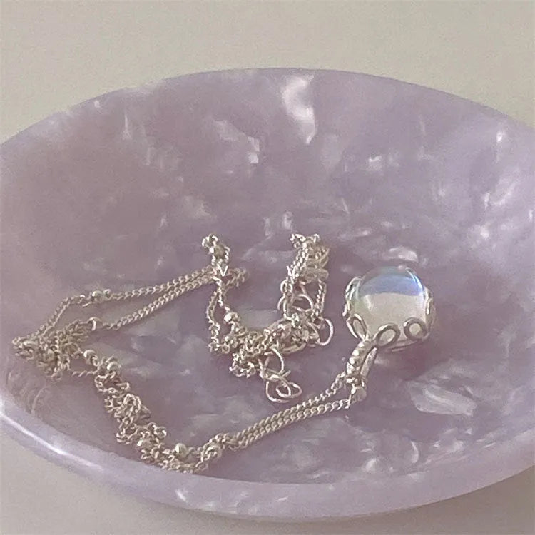 Silver geometric stone pendant on an adjustable curb chain necklace for women.