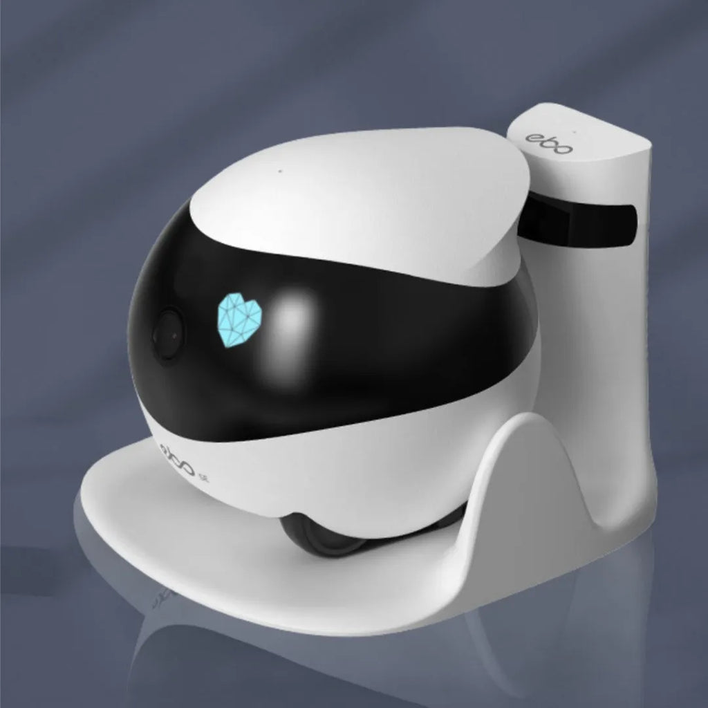 White smart home mobile robot camera with camera lens on a compact, wheeled body.