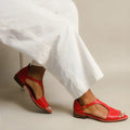 Red women's casual sandals with a square buckle and herringbone patterned toe holder on a breathable artificial PU upper.
