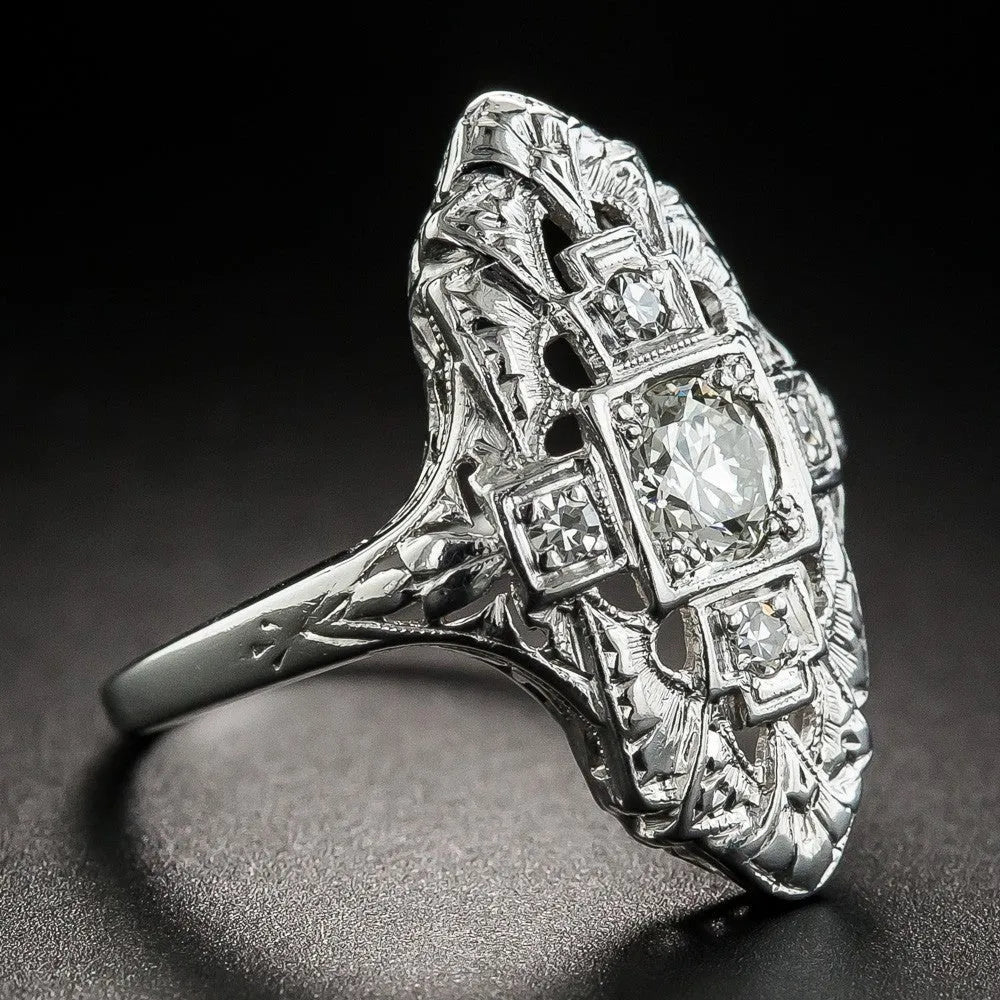 Hollow geometric silver-coloured ring with diamond studs on copper base