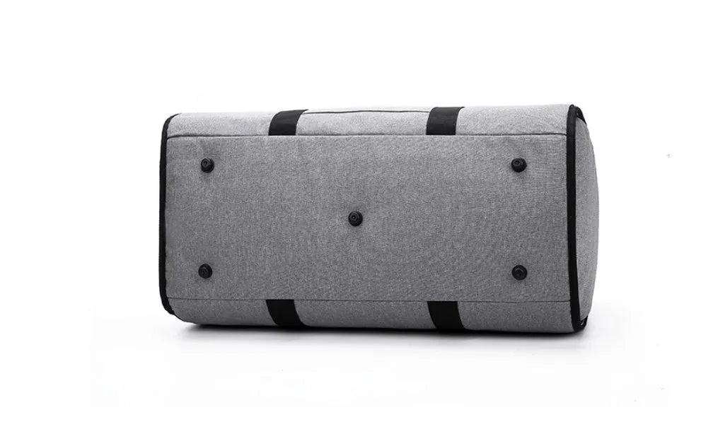 Medium cylinder-shaped travel duffle bag in black, made from Oxford cloth with a top zipper.