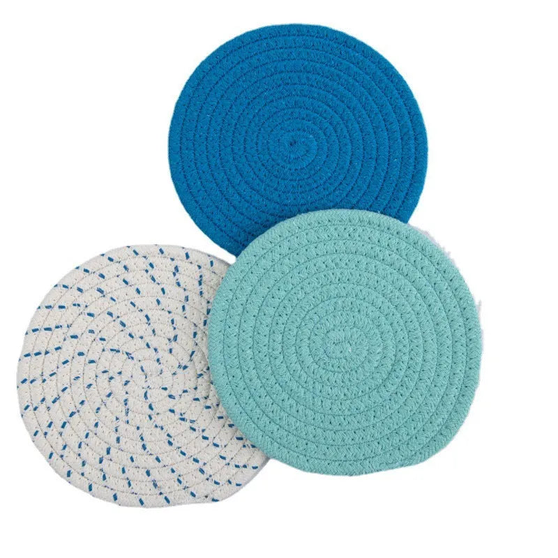 Three round cotton cord coasters in 18cm diameter showing grey, pink, purple and blue colour options