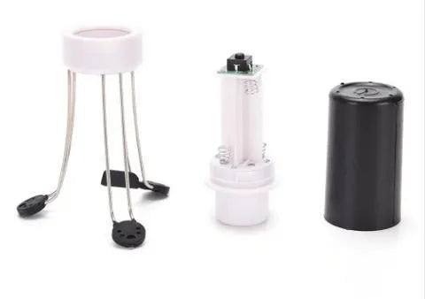 White and black wireless automatic blender with stainless steel stirring arms on kitchen counter