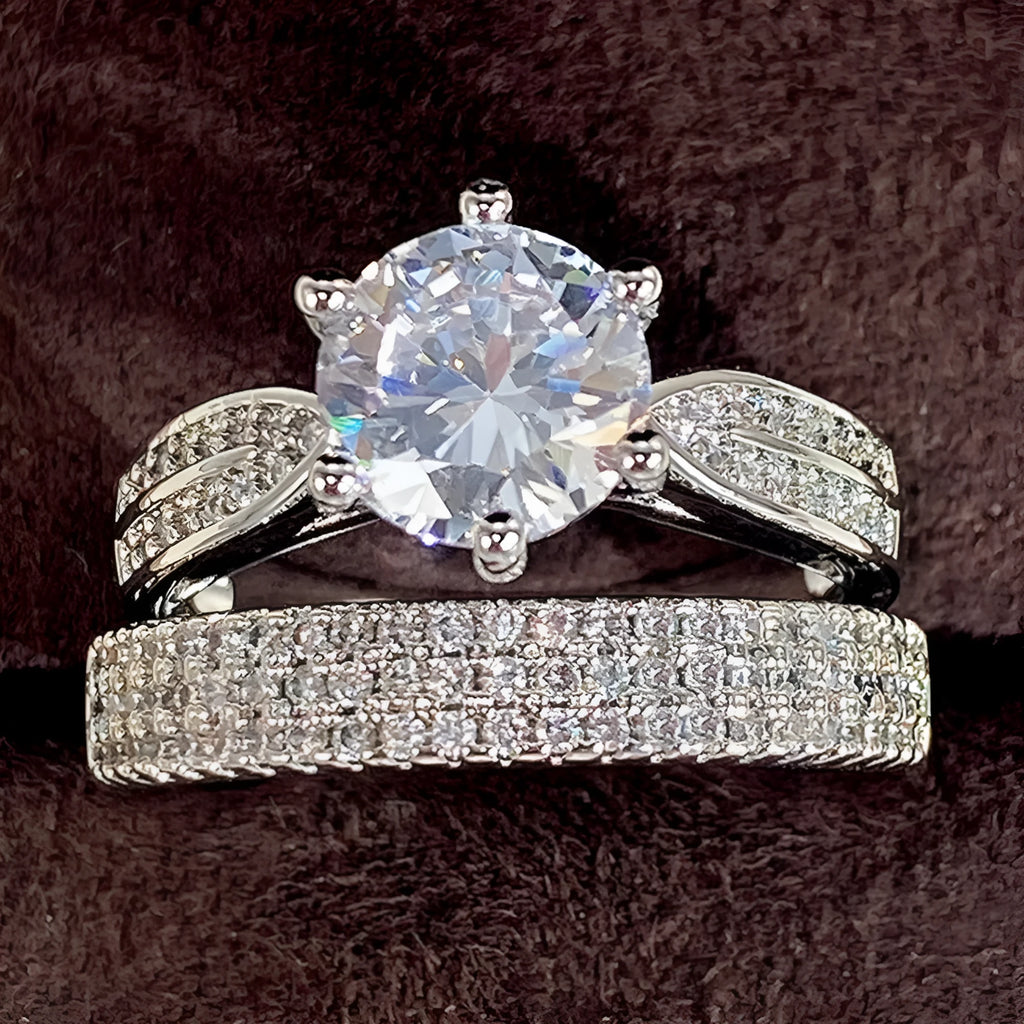 Geometric style wedding ring paired with a matching simple bracelet band in a white gold colour finish.