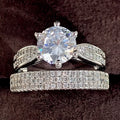 Geometric style wedding ring paired with a matching simple bracelet band in a white gold colour finish.