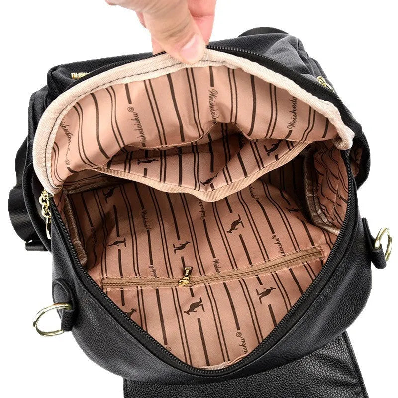 Genuine leather backpack with pendant and spliced belt detail for students and travellers, available in beige