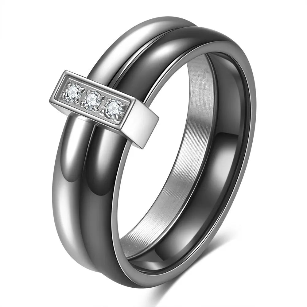 Steel black zirconium ceramic women's ring with 6mm wide band and glossy round inlay detail on a finger.