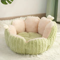 Green cactus design soft pet bed for cats or small dogs on a wooden floor.