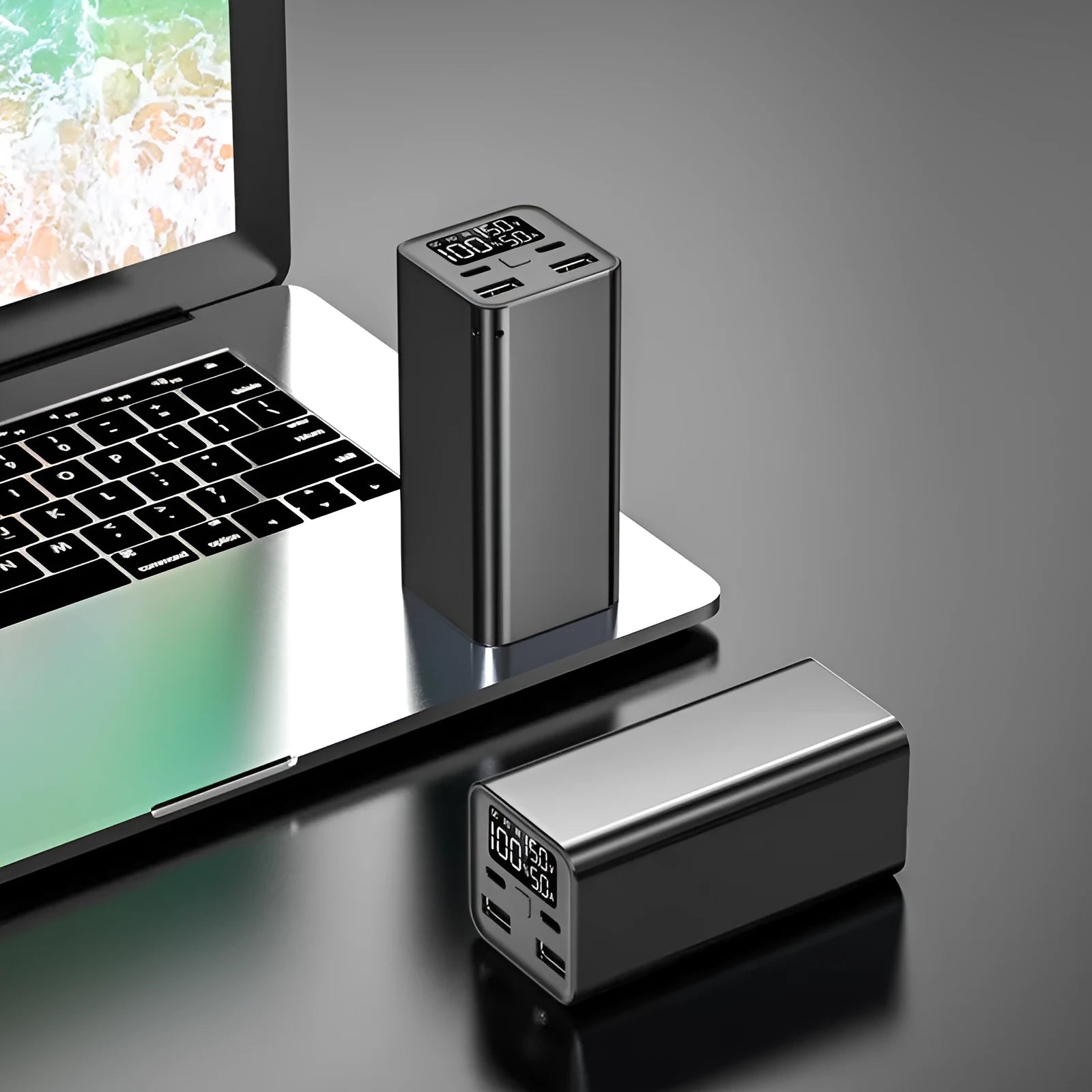 Metal laptop charging bank with 65W output and 20000mAh capacity in black, blue, or grey colours