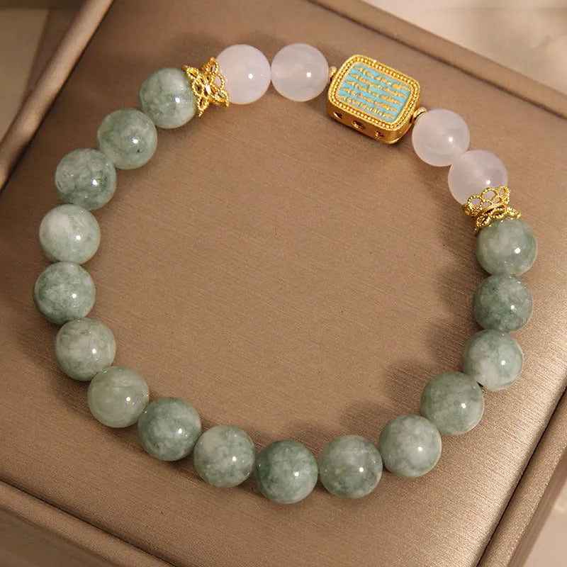 Women's oil green emerald crystal bracelet showing five engraved scripture sections
