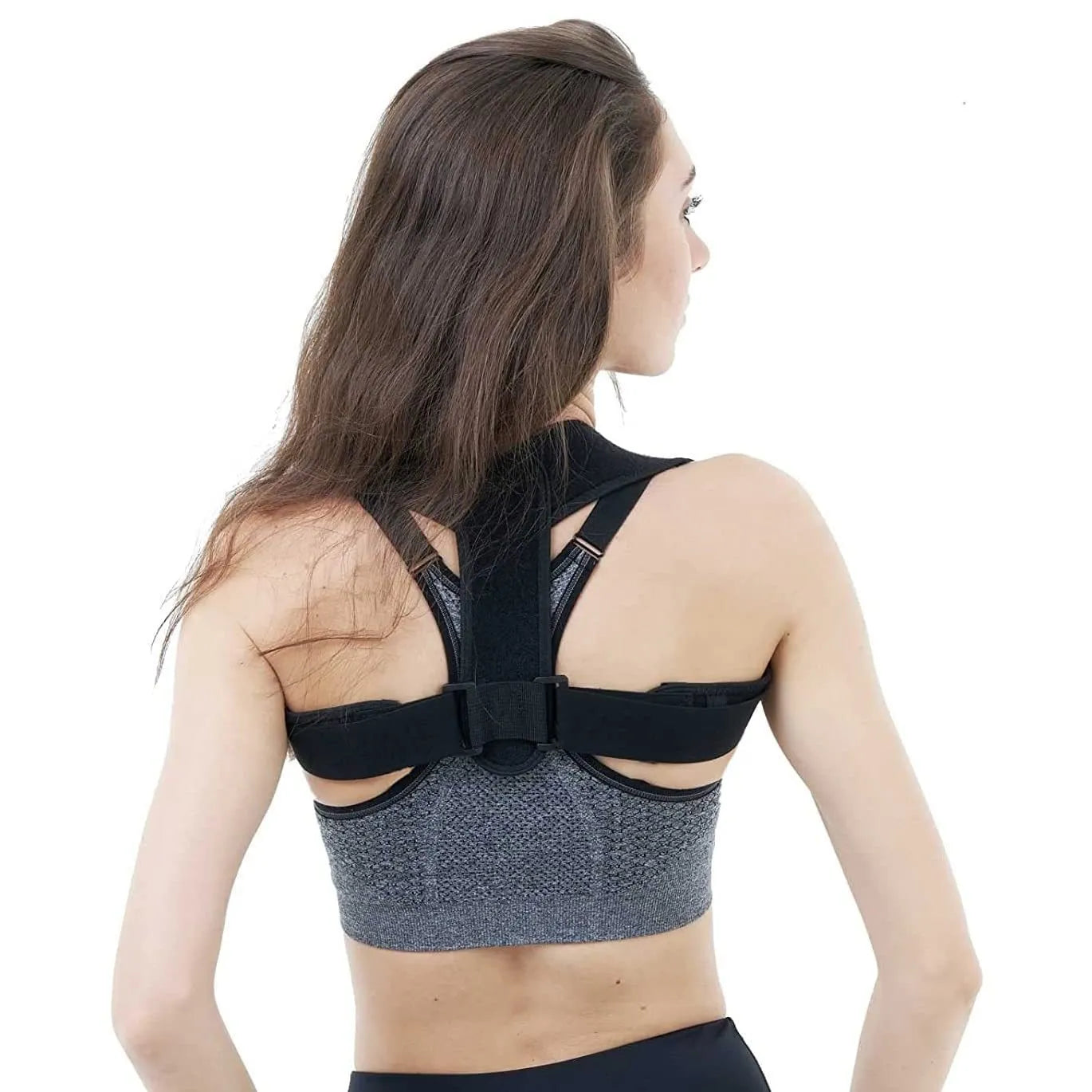 Black adjustable posture correction strap showing breathable construction and adjustable mechanism