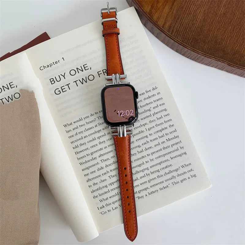 Genuine leather Apple Watch strap with metal stitching in brown colour on a dark background