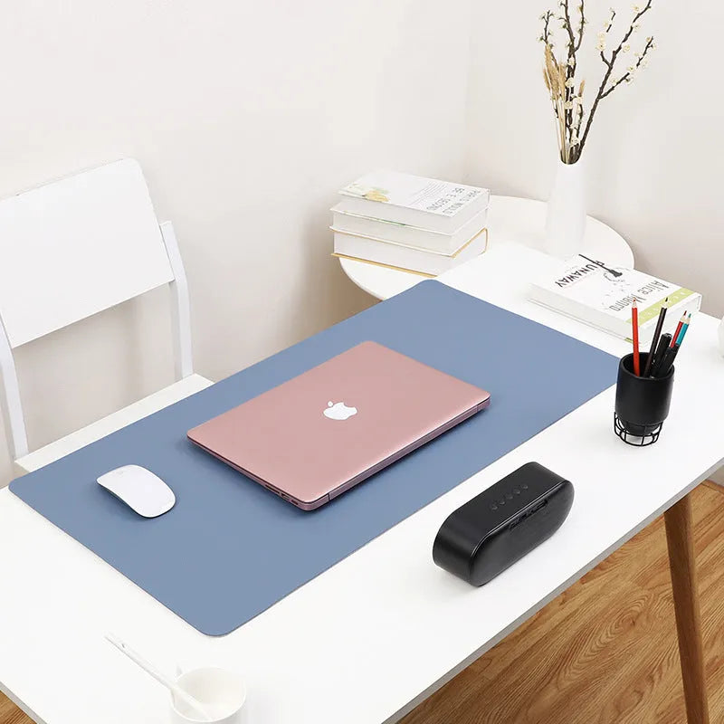 Extra large leather mouse pad in azure colour, 100x50CM size, on desk with laptop and wireless mouse