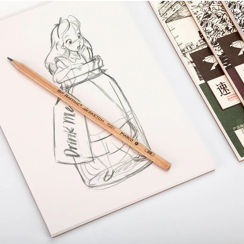A sketchbook open on a table, showing coil binding and heavy-weight paper suitable for drawing.